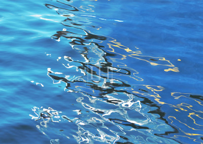 Lapis Lazuli reflections on blue lake water as fine art photographic image.