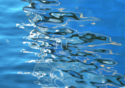 Lapis Lazuli reflections on blue lake water as abstract photographic image