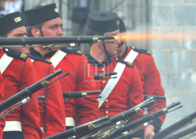 Fort Henry Guard in red jackets musket salute during Sunset Ceremony in Kingston Ontario Canada